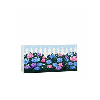 wooden replica with a Floral design with a picket fence with a blue background 