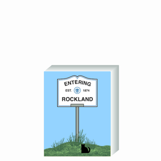 Wooden 3/4" Replica with a 'Entering Rockland' sign on a blue background