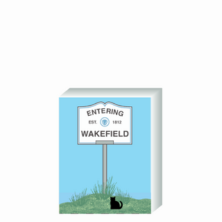Wooden 3/4" Replica with a sign designating 'Entering Wakefield' on a blue background