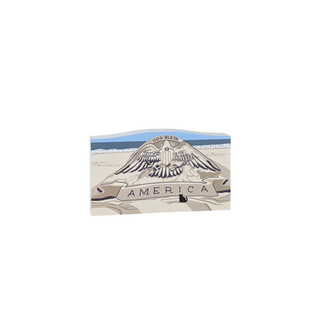 3/4" wooden replica with an illustration of a sand castle with an eagle and 'God Bless America' text on a white background
