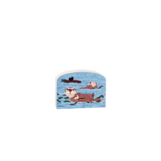 3/4" thick wooden Decorative tile with otter design on a blue water background