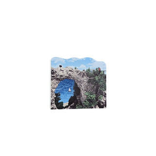 3/4" wooden replica with an illustration of a Cave entrance with a blue interior on a white background