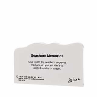 Back of wooden replica with 'Seashore Memories' text on a white background