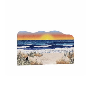 Wooden souvenir replica of a Beach scene with sunset, ocean, and sand dunes on a white background