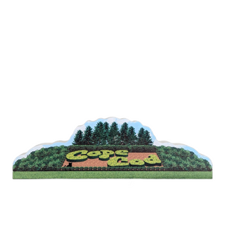Wooden sign of landscaping with 'Cape Cod' spelled out with hedges on a white background