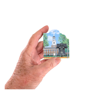 Hand holding a small 3/4" thick wooden cutout with a scenic view of Independence Hall and the Liberty Bell.