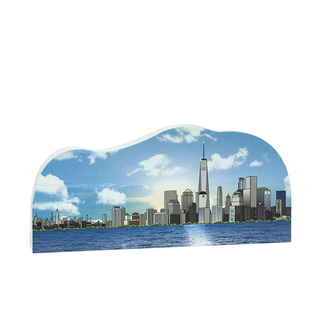 3/4" thick wooden cutout of NY City skyline with a prominent skyscraper against a blue sky with clouds.