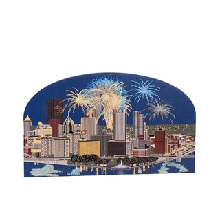 3/4" thick wooden cutout of the Pittsburgh City skyline with fireworks against a blue sky