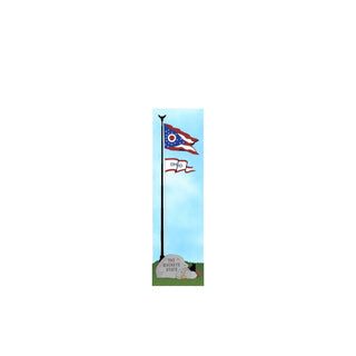 3/4" thick wooden cutout of an Ohio state flag on a pole with a stone plaque below against a blue sky.